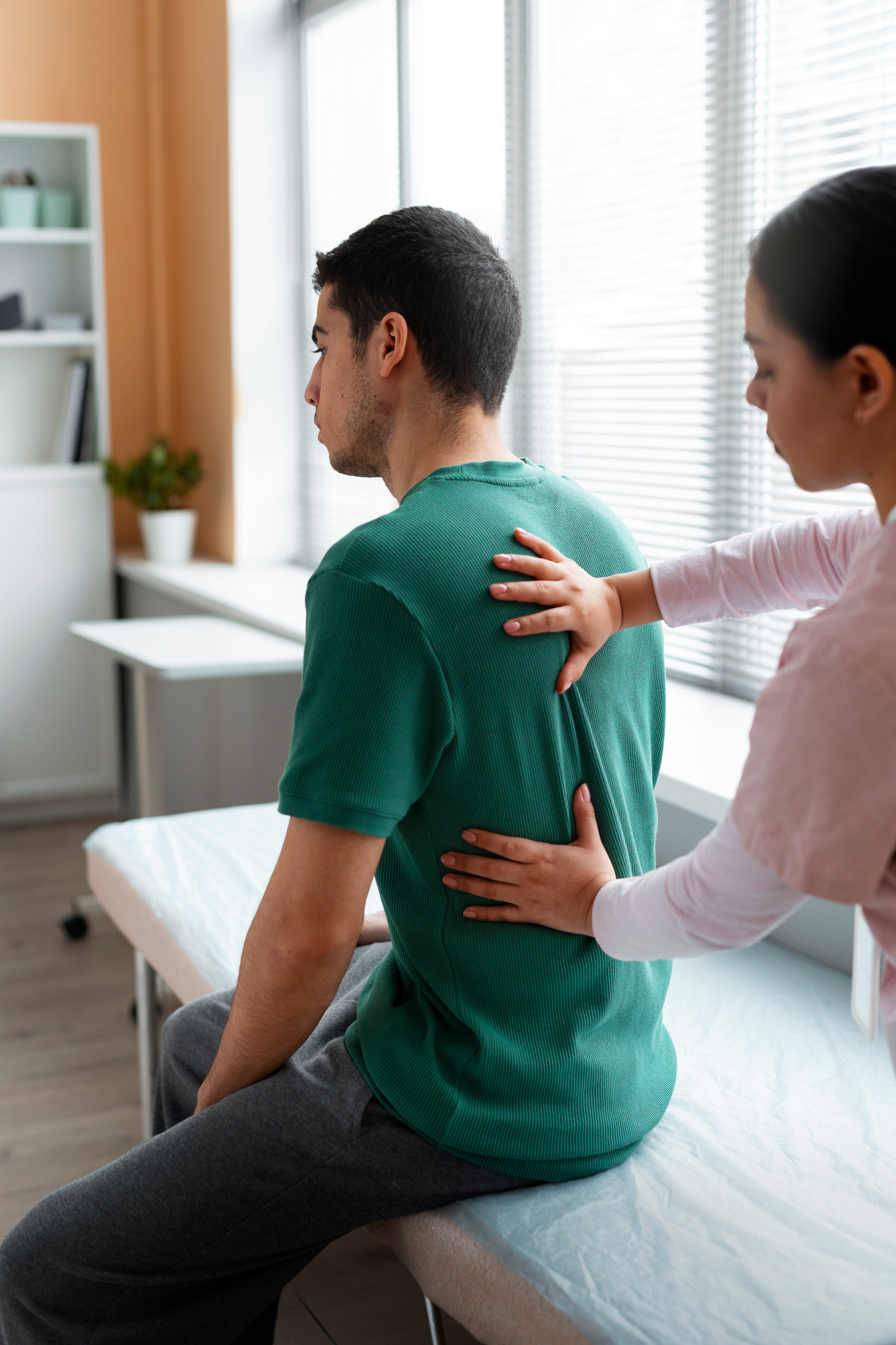 doctor-helping-patient-rehabilitation